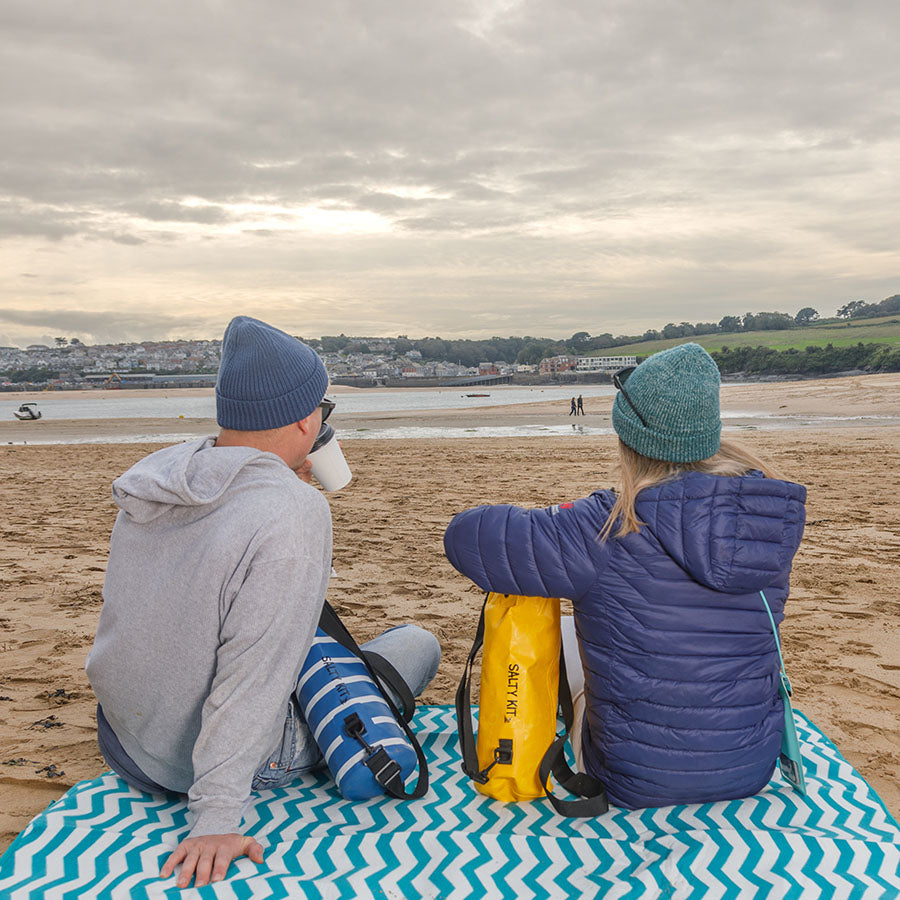 couple looking towards padstow using salty kit 5 litre dry bags 