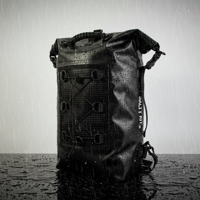 Black waterproof backpack with visible brand logo on a gray background