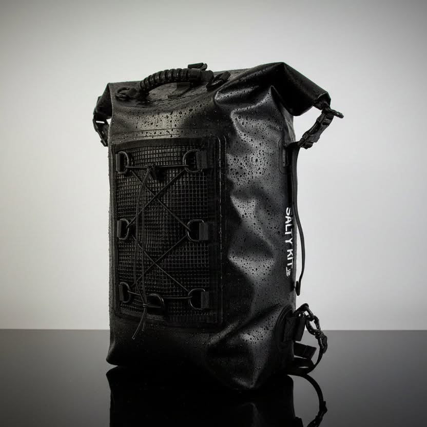 Black 30 litre waterproof backpack in studio setting
